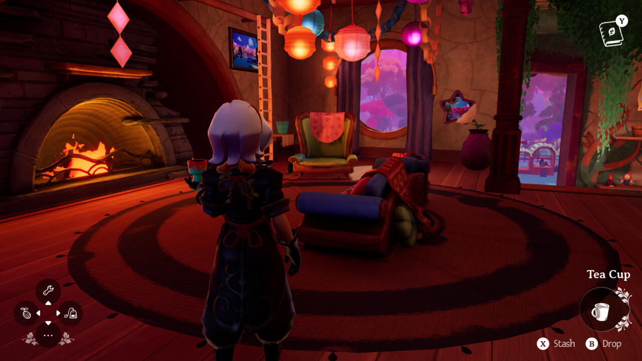 Alta takes in her cozy surrounding while holding a cup of tea.