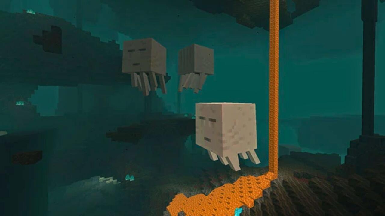 Three Ghasts fly around the Nether