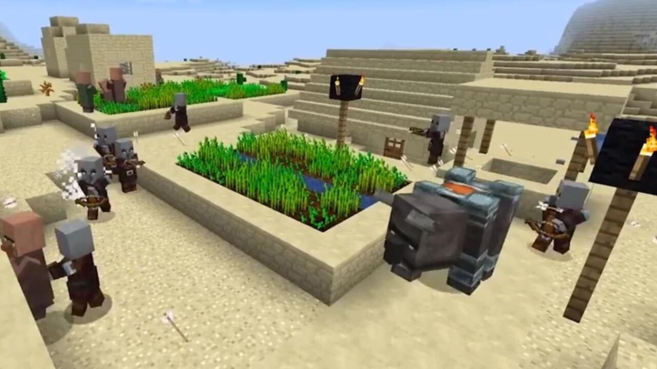 Multiple hostile mobs and a Ravager attack a desert village in a raid